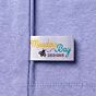 custom dye sublimation printed label sewn into seam of shirt