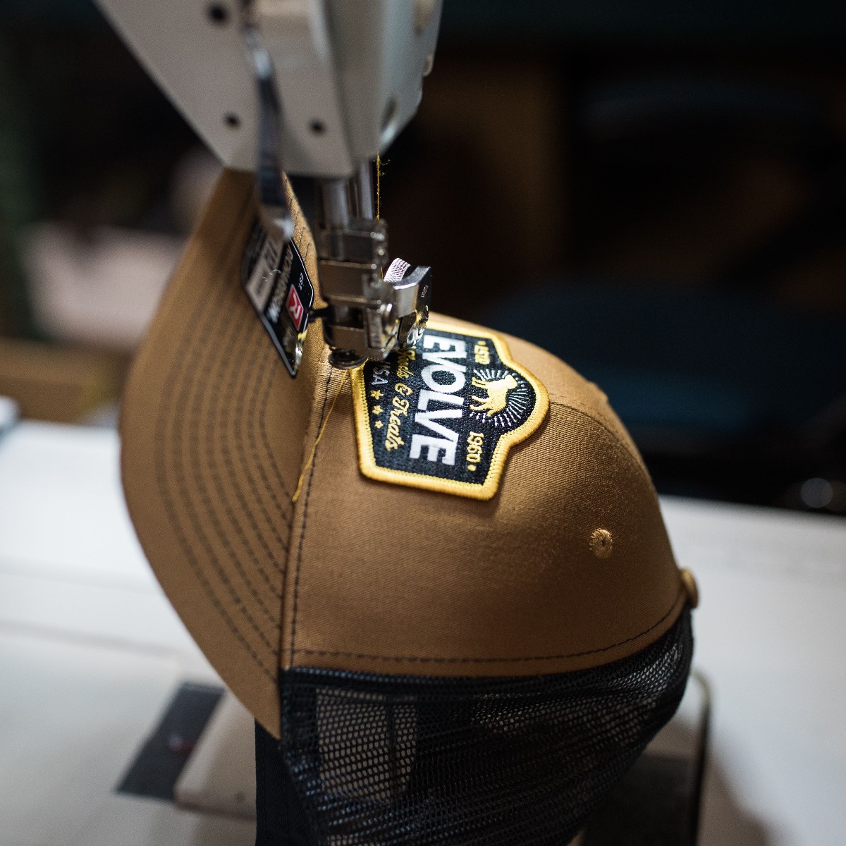 Custom hat patch application process showing sew on application