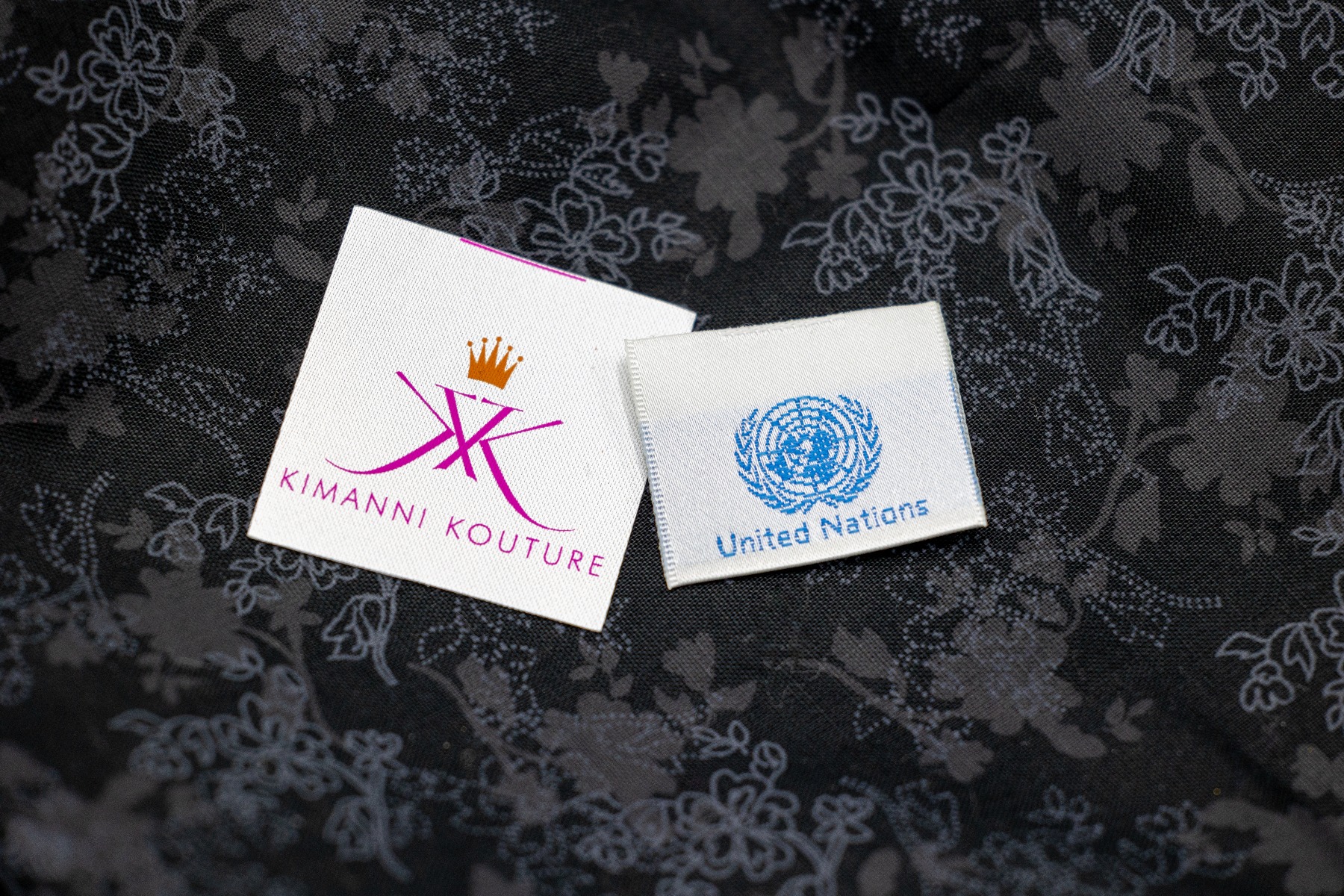 Printed vs woven labels comparison showing quality differences between digital printing and woven construction