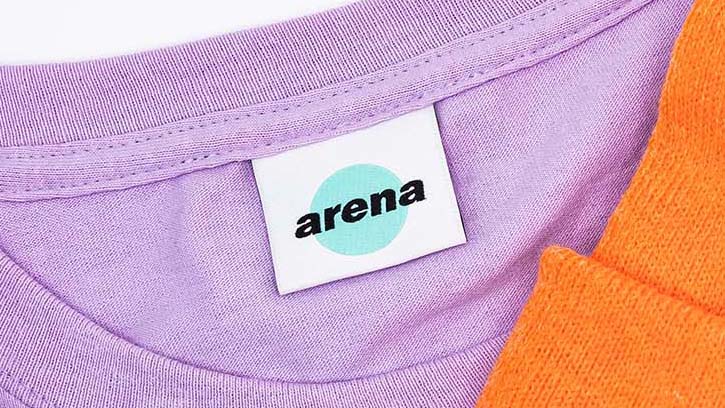 Extreme close-up of custom woven label showing individual thread texture and professional finishing quality